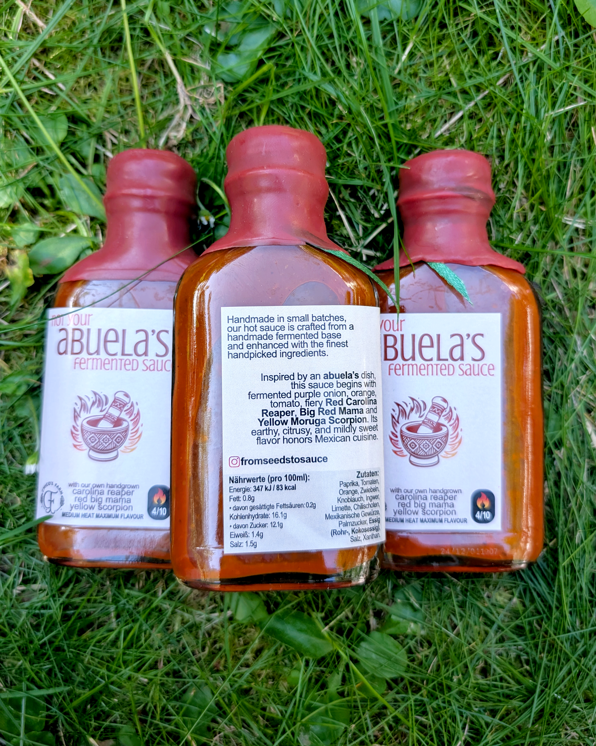 Not Your Abuela’s Mild hot sauce bottles outdoors – handcrafted Tex-Mex fermented sauce line-up