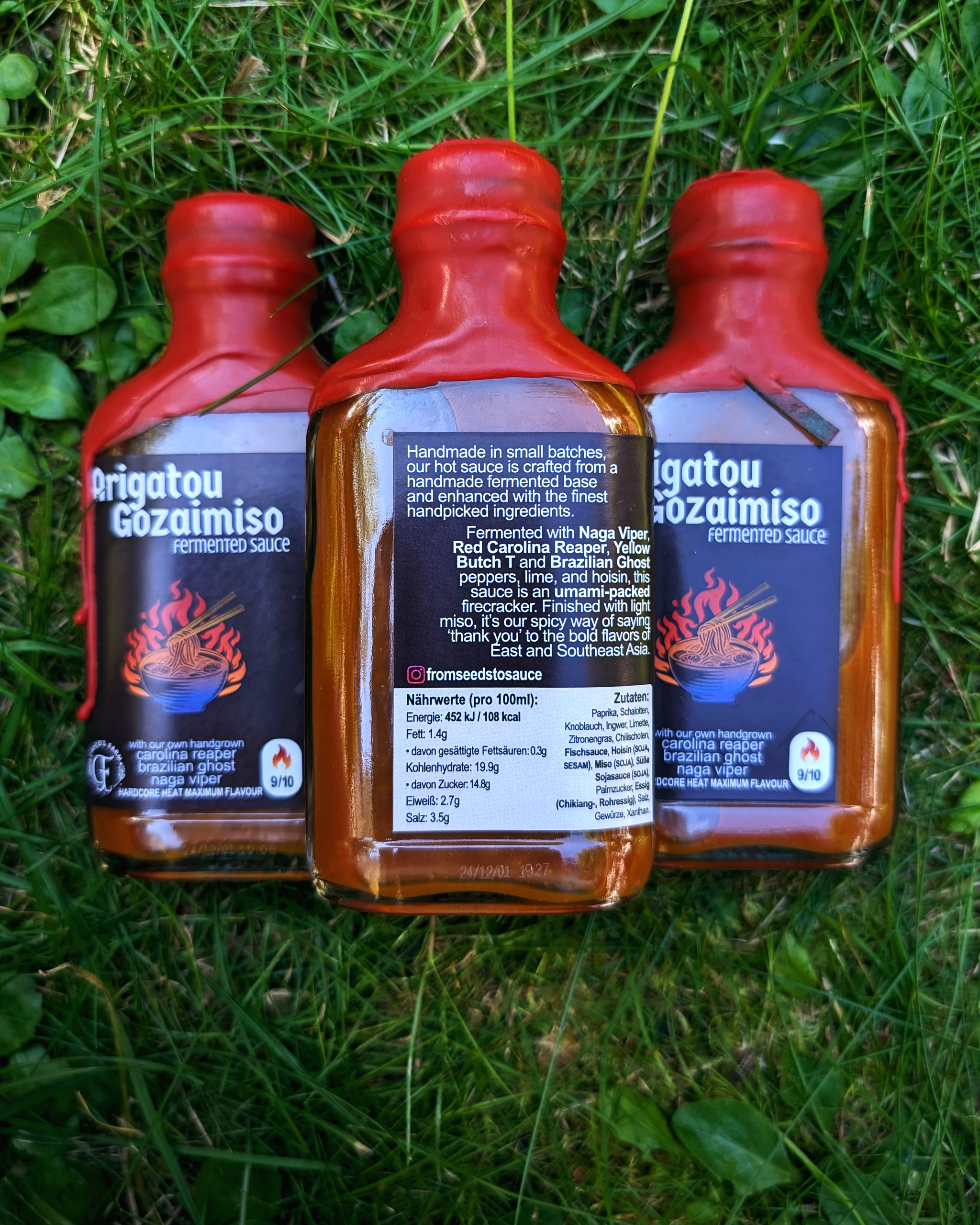 Arigato Gozaimiso hot sauce bottles outdoors – fermented miso, lime and lemongrass lineup with bold heat