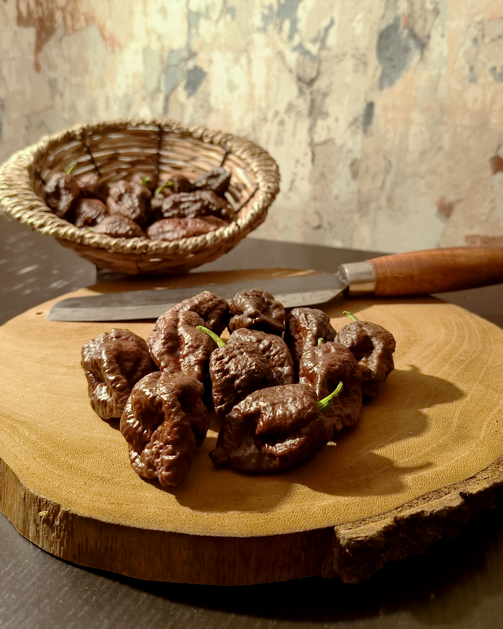 Chocolate Bhutlah chili pods showing wrinkled superhot texture