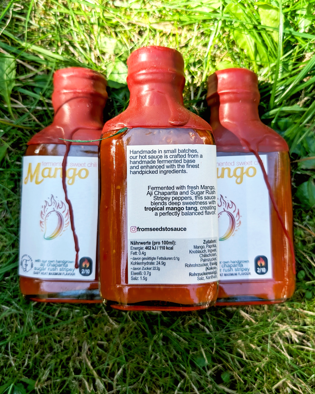 Mango Sweet Chili hot sauce lineup – fermented sweet chilli sauce bottles outdoors