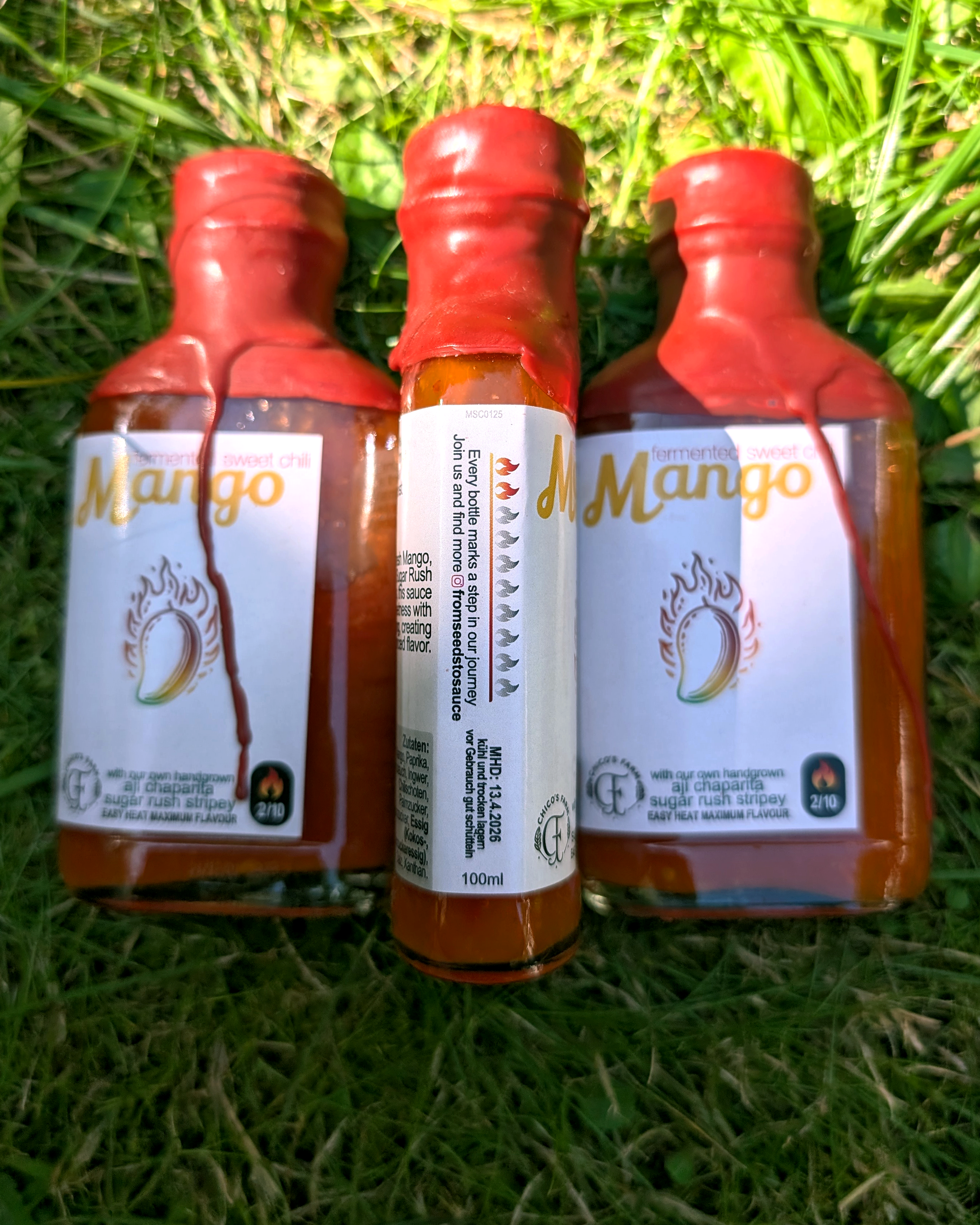 Mango Sweet Chili fermented hot sauce – multiple bottles with bright mango colour